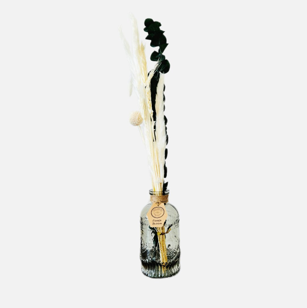 Dried flowers in a Jean bottle