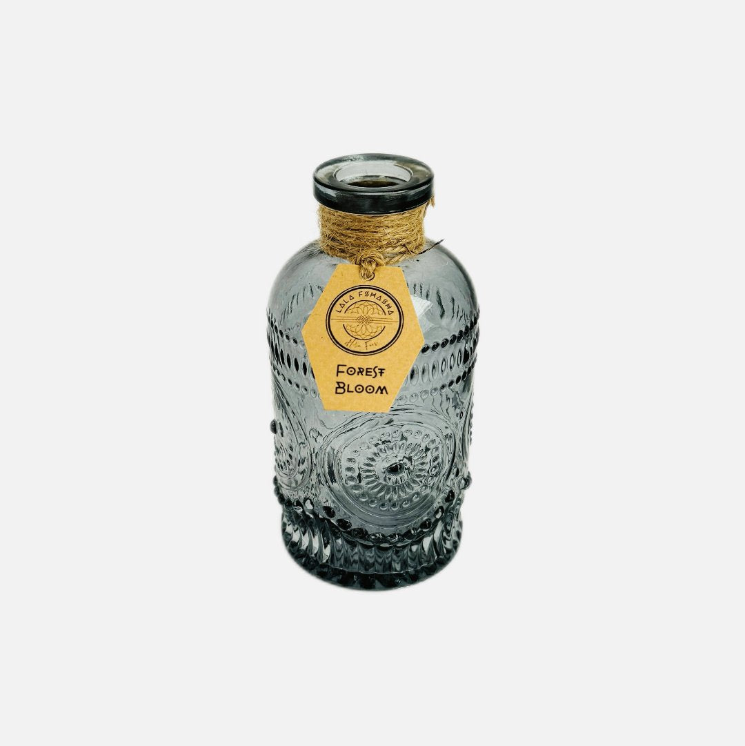 Dried flowers in a Roy bottle