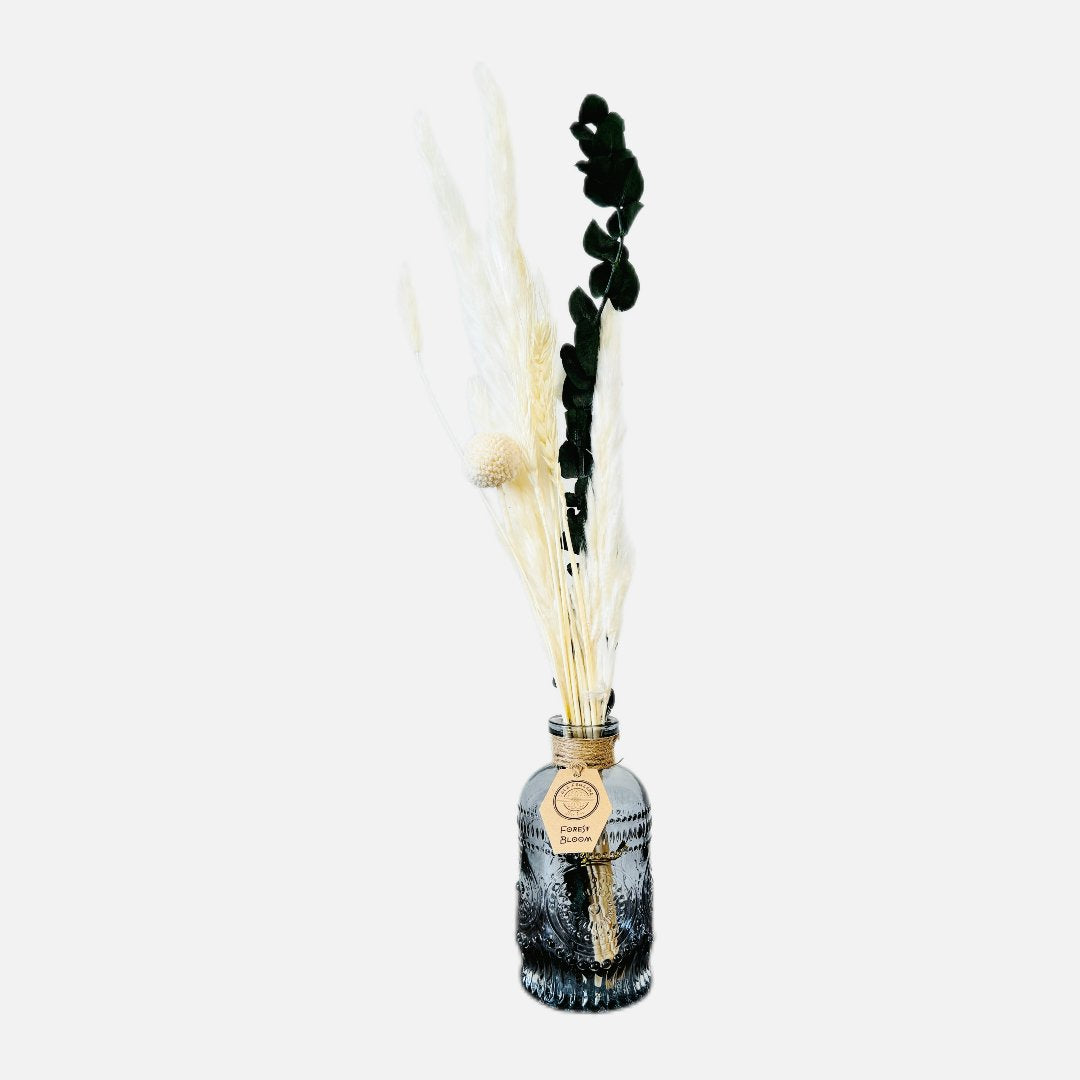 Dried flowers in a Roy bottle