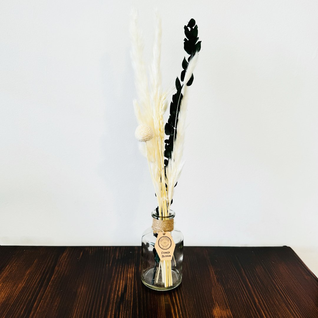 Dried flowers in a Tamar bottle