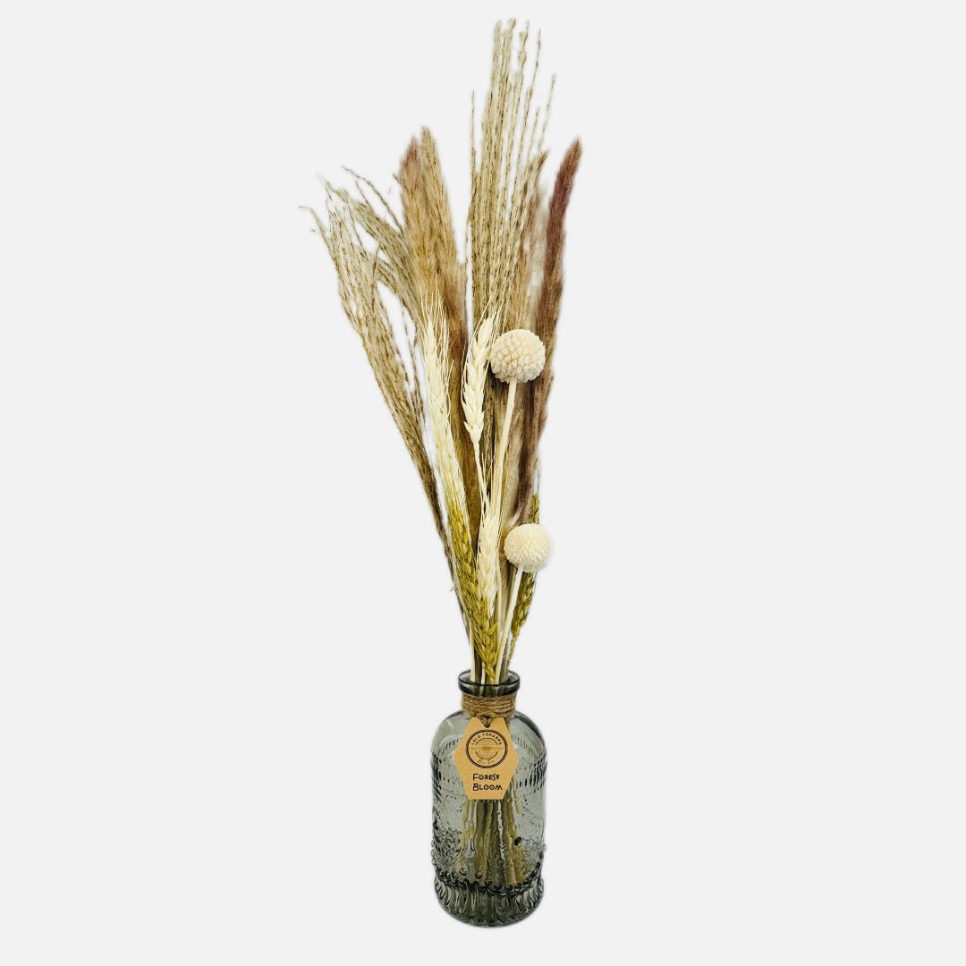 Dried flowers in a Jean bottle