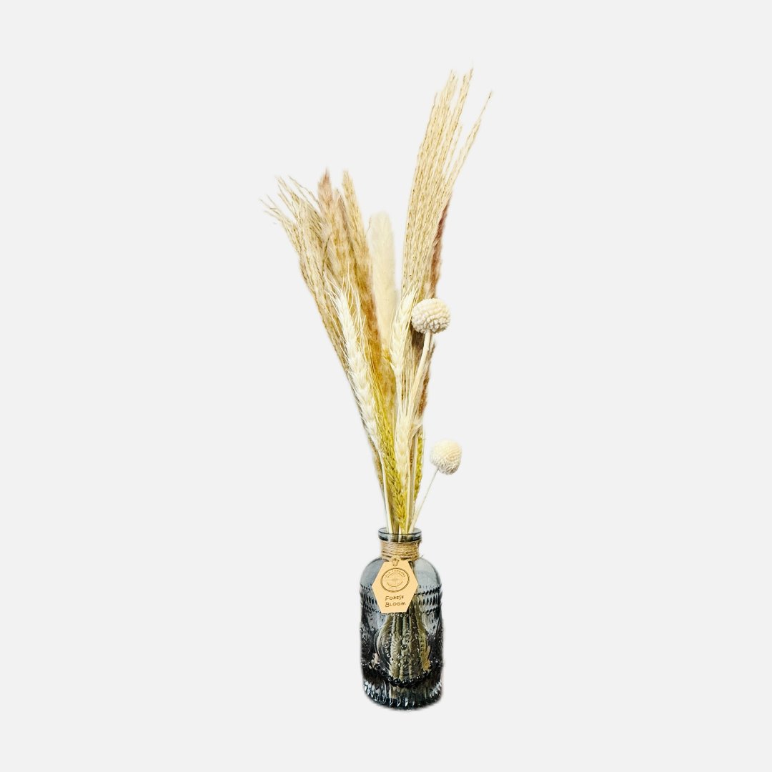 Dried flowers in a Roy bottle