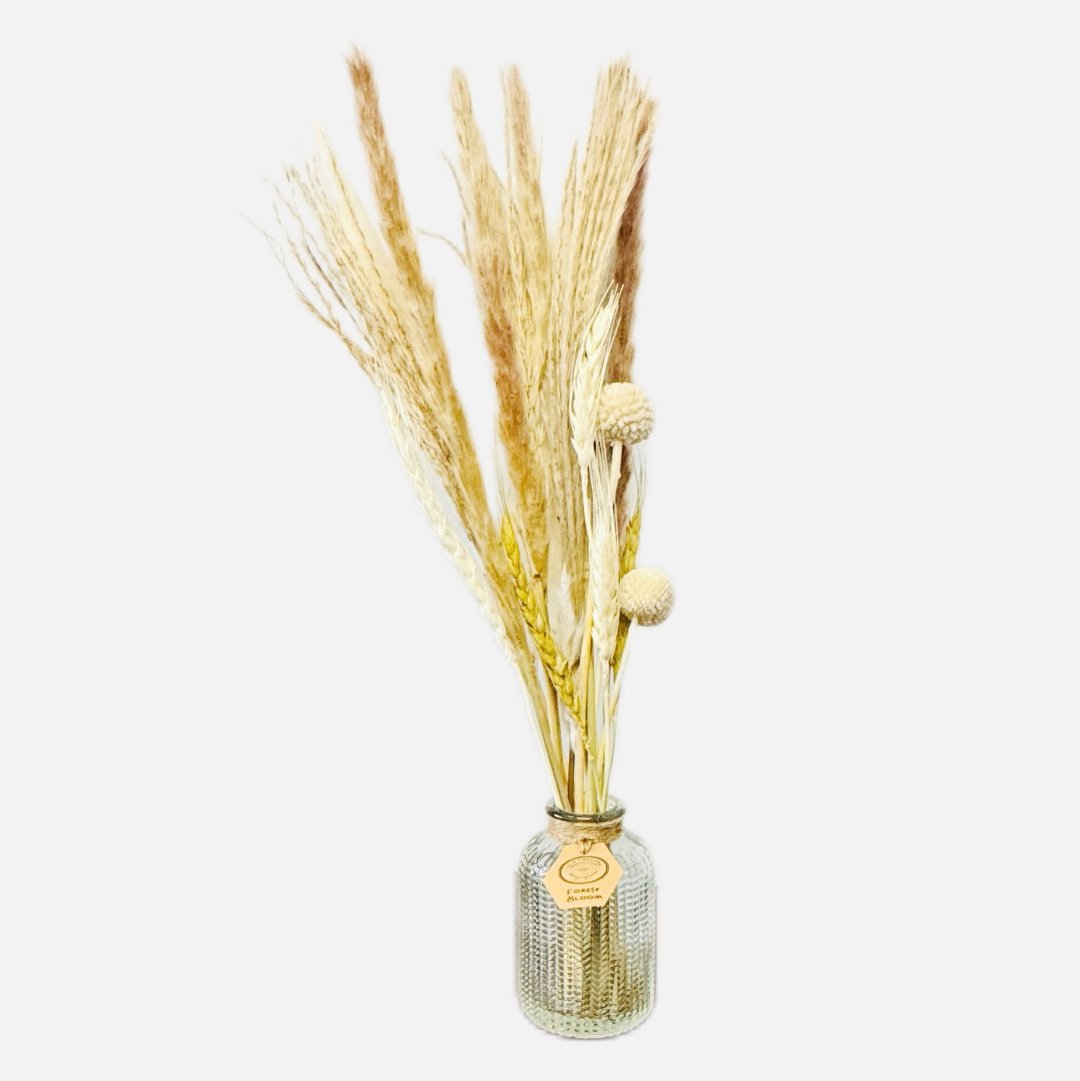 Dried flowers in a Raphael bottle