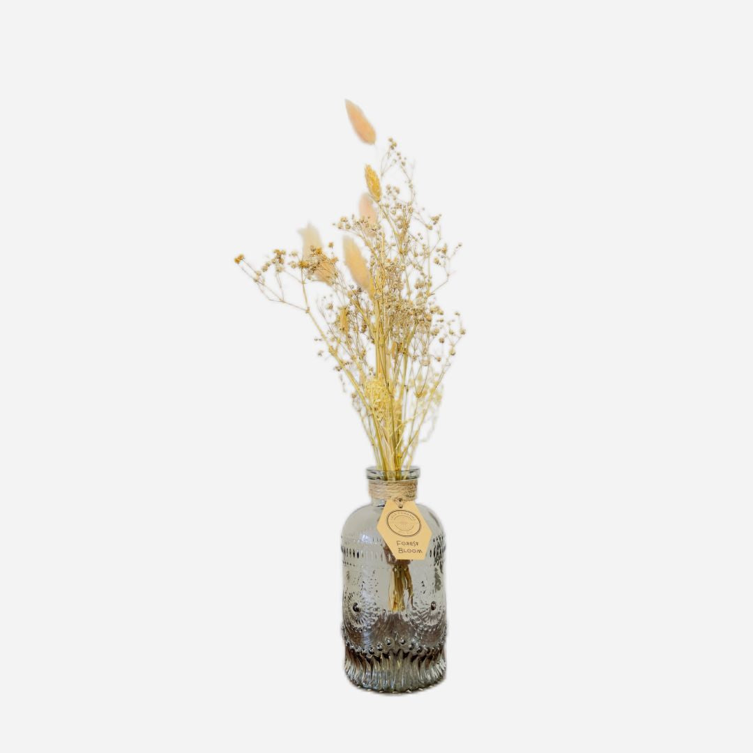 Dried flowers in a Jean bottle