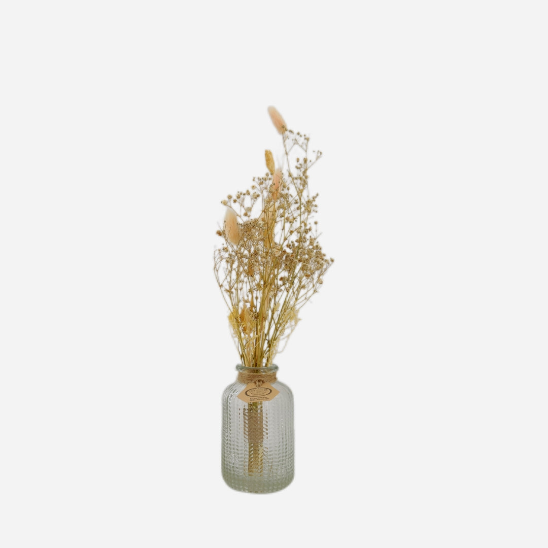 Dried flowers in a Raphael bottle
