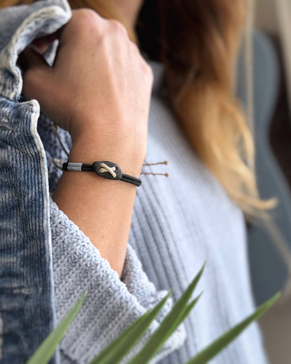 Handmade macrame bracelet with natural dark pebble, black and light blue cords – Ground