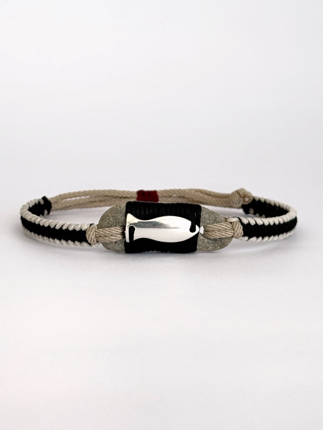 Handmade macramé bracelet with natural pebble and silver fish charm, minimalist unisex design - Granite